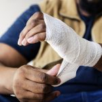 Man Wrapping Injured Hand After Construction Injury